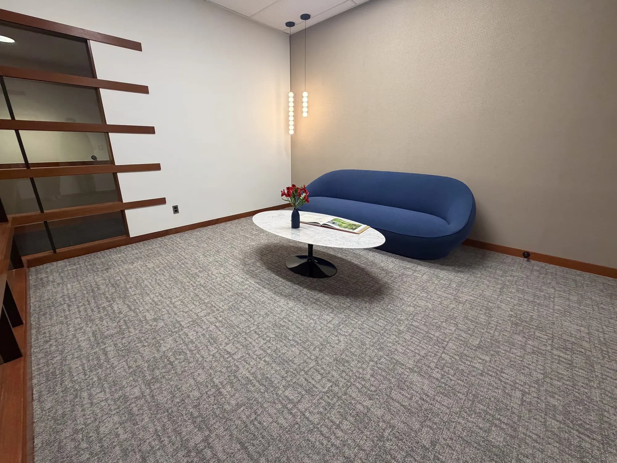CCT City & Let's Go! carpet tile in Milwaukee in a lounge with a blue sofa at an AI startup office in Ann Arbor, Michigan