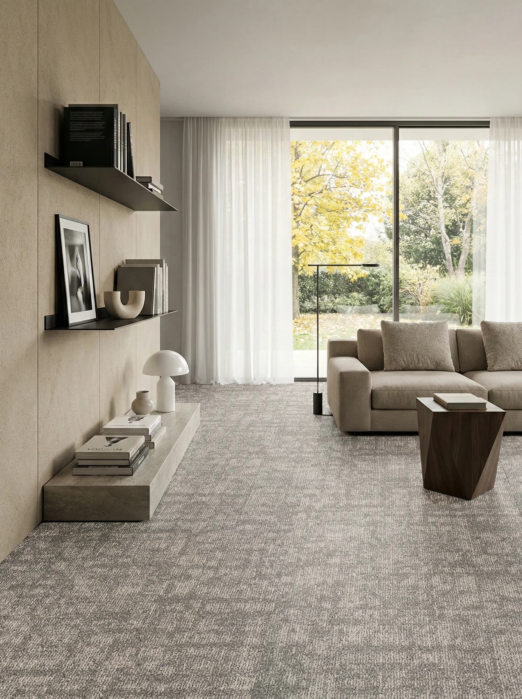 CCT City carpet tile in a modern living room with floor-to-ceiling garden views